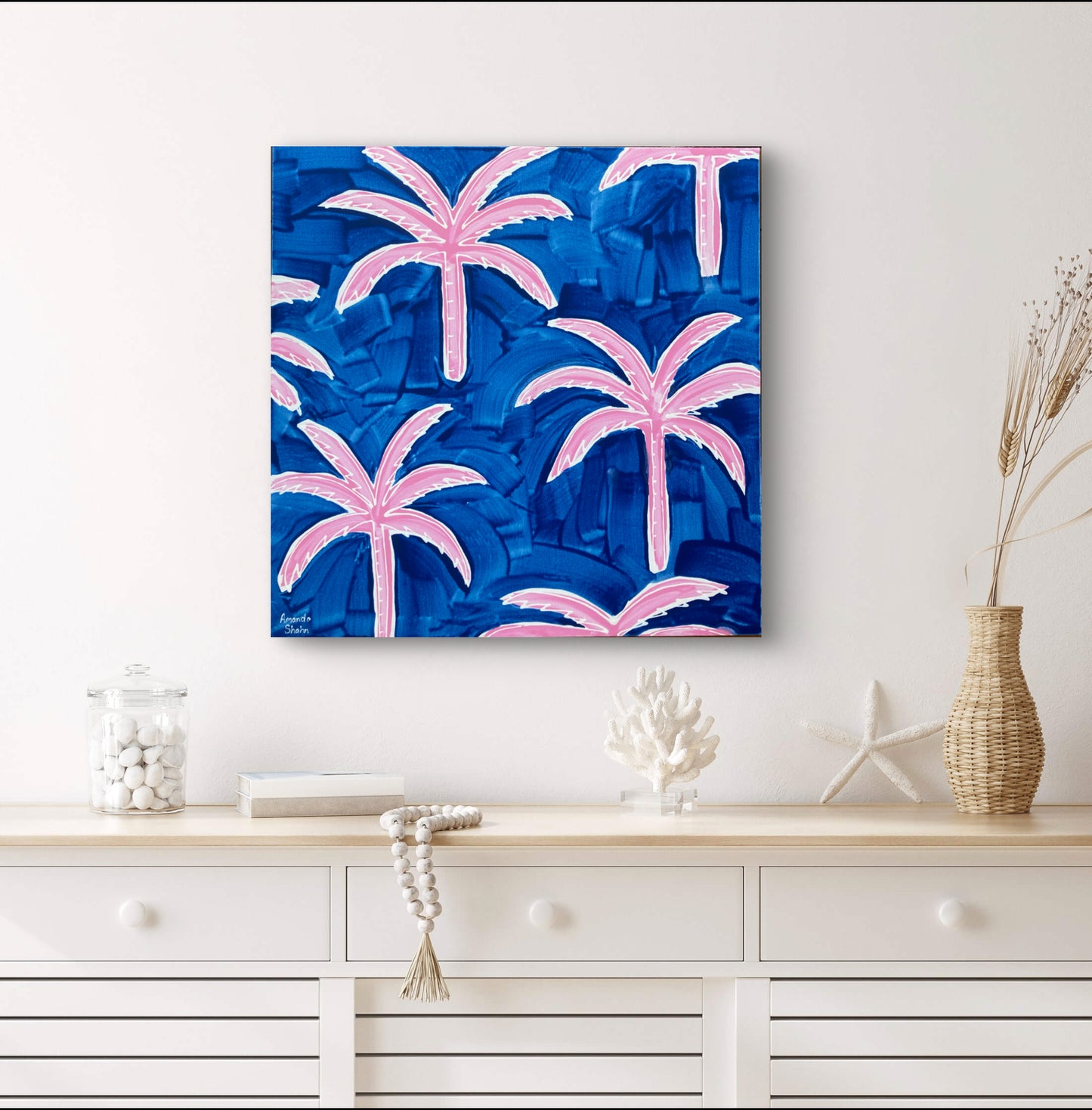 Chasing Paradise shown in situ above a hall table decorated in a beachy, coastal style