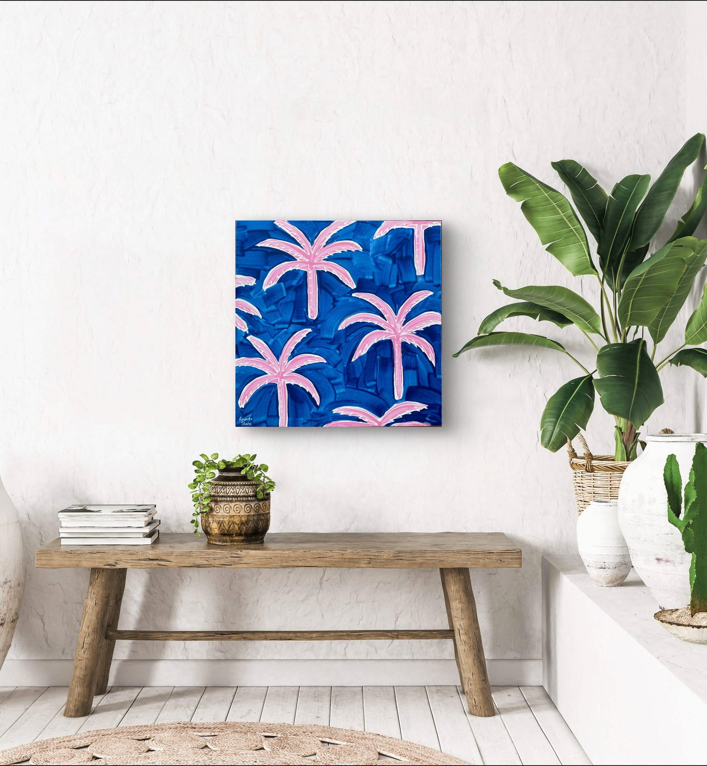 Chasing Paradise shown in situ above a hall chair with some plants