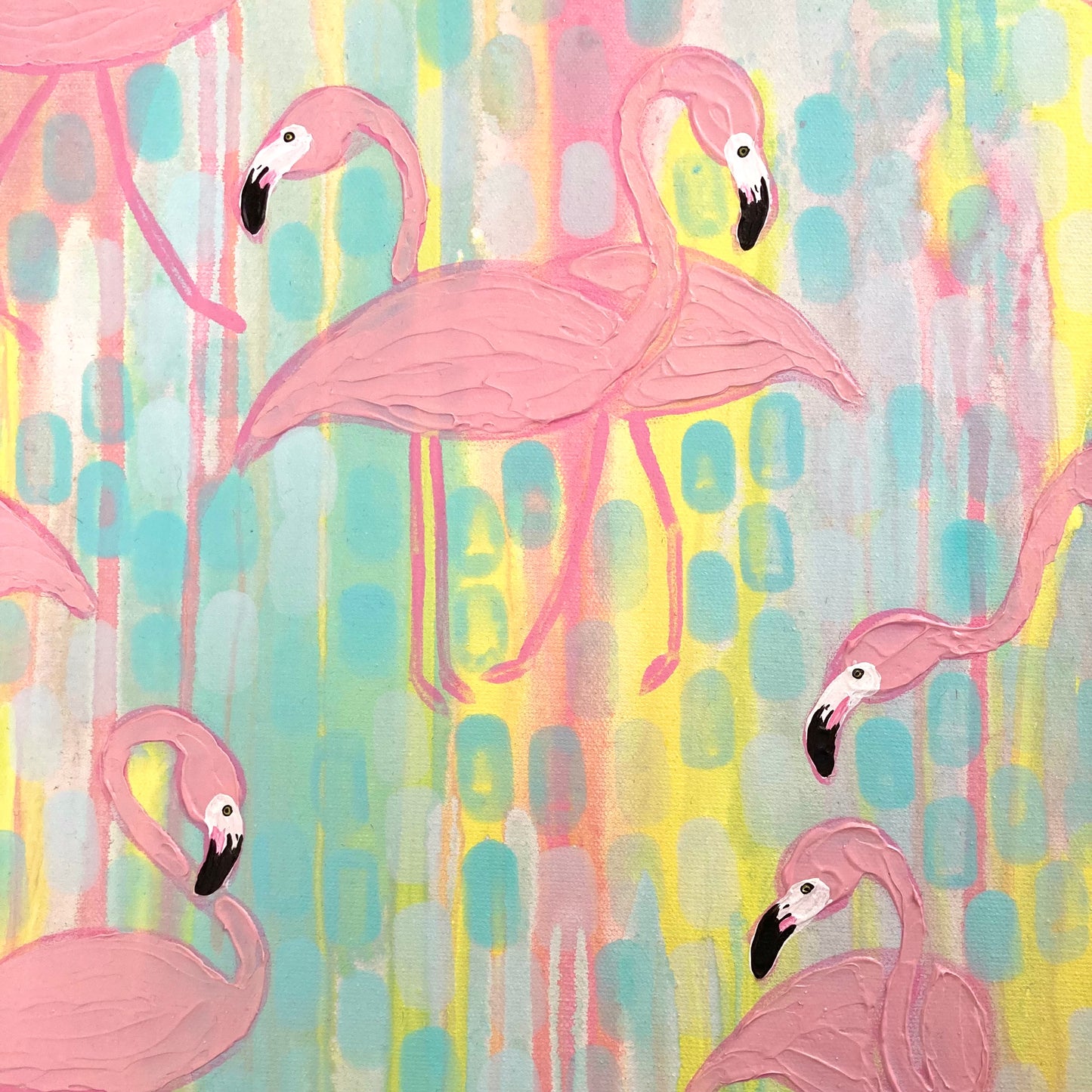 Up close details showing the flamingos faces and background details